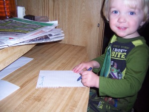 "writing" his letter to santa.